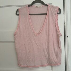 Free People 100% cotton light pink tank. Small hole in back.